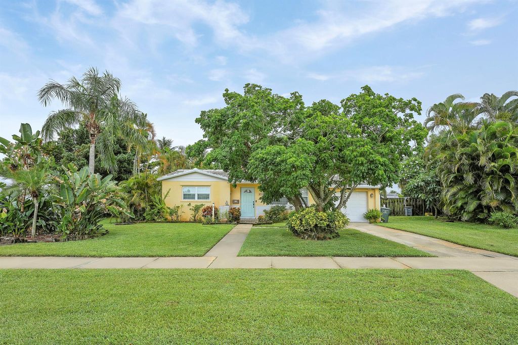 Photo of 744 W Ilex Drive, Lake Park, FL 33403 (MLS # R11103678)