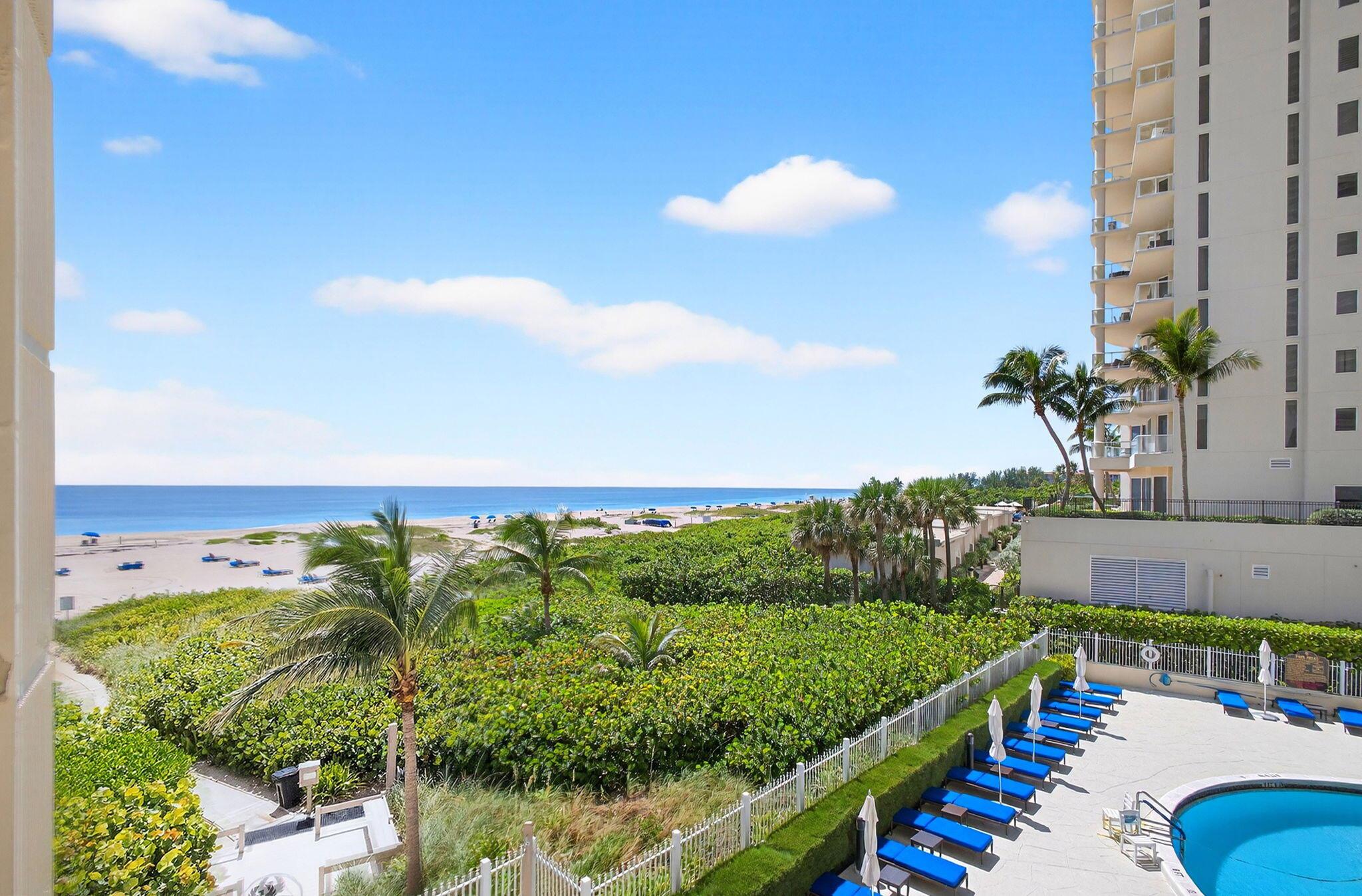 OCEAN and POOL Views in this 3rd floor, 2bed 2bth split-floor with spacious bedrooms on either side of living area. Step out to your private balcony & enjoy breathtaking sunrises over the Atlantic. New Carpets, Newly painted, new electric solar shades. Bright & airy living space floods the home w/natural light. Kitchen is updated, modern & efficient, ideal for preparing meals to enjoy while taking in stunning views. Residents of Phoenix Towers enjoy access to resort-style amenities, including heated pool, private beach access, fitness center, tennis courts, & social room. Located on Singer Island & minutes from world-class dining, shopping, golf courses, marinas & more.