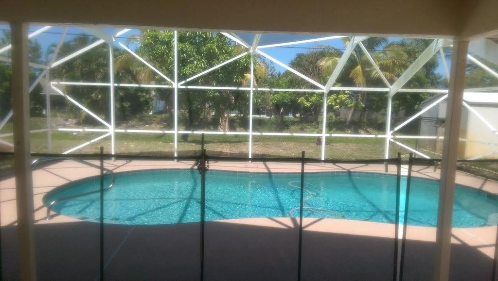 Photo of 1423 SE Grapeland Avenue, Port Saint Lucie, FL 34952 (MLS # F10500015)