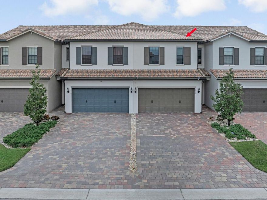 Welcome to The Fields in Lake Worth -- a gated, resort-style community by DiVosta Homes. This beautiful Adirondack Model townhome offers modern design, quality construction, and an easy low-maintenance lifestyle. Featuring 3 bedrooms, 2.5 baths, and nearly 1,900 square feet of living space, this home combines functionality with refined comfort.The open-concept main floor includes a spacious living and dining area, a designer kitchen with a large island, quartz countertops, stainless steel appliances, and upgraded cabinetry. Upstairs, the generous primary suite offers a walk-in closet and a luxurious ensuite bath with dual vanities and a glass-enclosed shower. Two additional bedrooms, a full bath, and a laundry room complete the second floor.