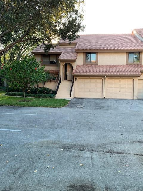 This is a beauty in central Boca Raton. Professionally updated. washer/dryer 2 years old, a/c 2 years old. Everything is Top of the line. Granite counter tops, glass tile back splash, stainless steel appliances, dark rich wood cabinets. 22 inch ceramic tile through out living areas. Designer top grade carpet in two bedrooms. Glass enclosed air conditioned patio adding 200 sq. ft. more to the home. a/c and hot water heat heater 2 years old. One car garage, indoor laundry room. Amazing, gorgeous, easy show easy sale. SOLD AS IS.