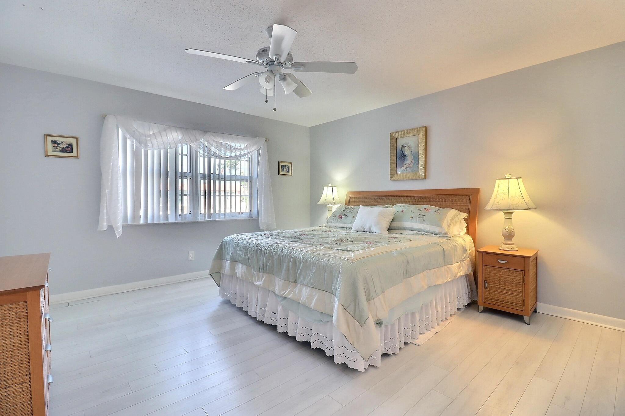 Welcome to this beautifully maintained 2nd-floor condo located in a peaceful and friendly 55+ community in the heart of Pompano Beach! This light and bright 2-bedroom, 1.5-bath unit offers a spacious layout with generous bedroom sizes and plenty of natural light. New Vinyl flooring throughout! Step outside to your covered and screened balcony--a perfect spot to relax with your morning coffee while enjoying tranquil views overlooking the bocce courts. Additional features include low monthly HOA fees, assigned parking, communal laundry, and access to fantastic amenities like a sparkling community pool and bocce courts.Just minutes from shopping, banks, dining, and everyday conveniences, this condo offers the ideal blend of comfort, affordability, and active adult living
