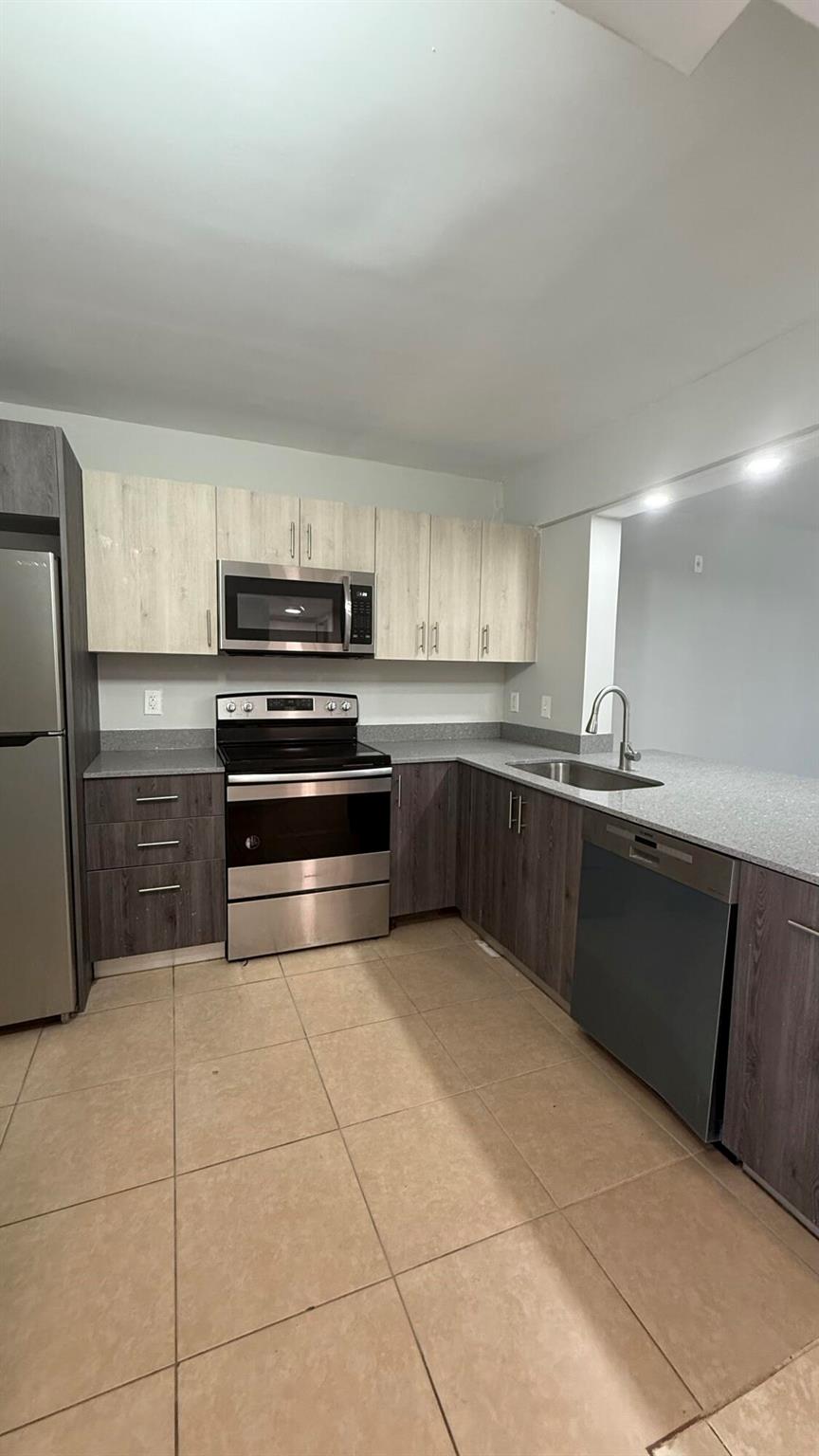 Beautifully renovated first floor 2 bed, 2 bath unit in a prime location near the airport, Clematis, City Place, and Astro Park. Includes in-unit washer/dryer, $100 flat water fee, and a soon-to-be gated property with security cameras. Moving fast--don't miss out!