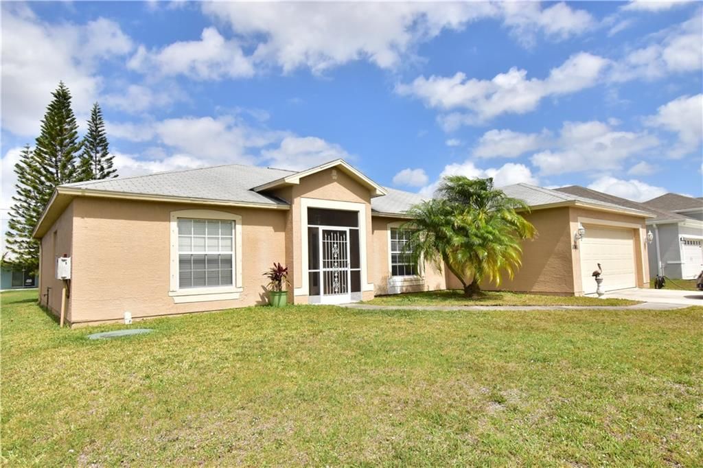 Photo of 1041 SW Mccracken Ave, Port Saint Lucie, FL 34953 (MLS # F10320730)