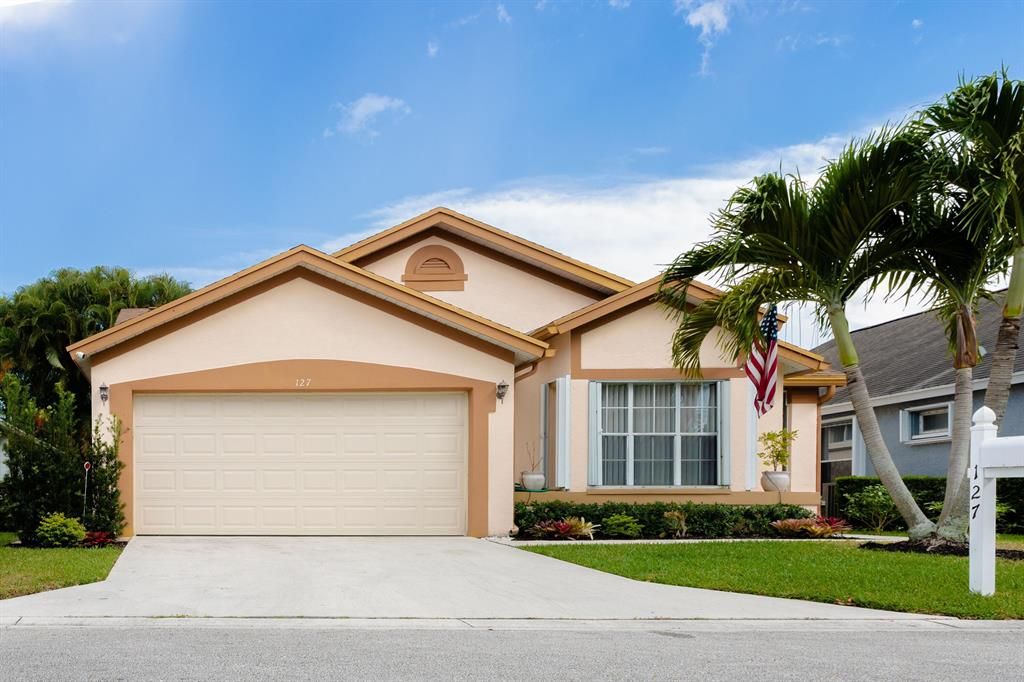 Photo of 127 Hammocks Drive Dr, Green Acres, FL 33413 (MLS # R10784888)