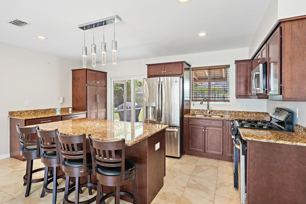 Photo of 272 Holly Drive, Palm Beach Gardens, FL 33410 (MLS # B26026109)
