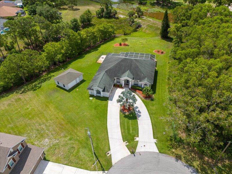 Step into your dream home, spacious floor plan, spectacular view, on cul de sac, oversized lot on greenbelt, overlooking canal and St. James Golf Course. One of the best locations/views in PSL.This 3/2.5/2 is a custom home - Includes 90 gallon saltwater aquarium, Game Room with extractor fans, Office, Pool w/Jacuzzi, propane gas for pool, bbq, cooktop, dryer and water heater. There is a 20x20 detached CBS ''Hobby Room/Workout Room'' on site.Additional outlet for 50am RV and for generator.Just a few of the extras!10' ceilings/vaulted entry, Built in computer desk or convert to a Coffee Bar, Eat at bar, Recessed lighting, Plant shelves, Security Alarm System, Central Vac and so much more!!!