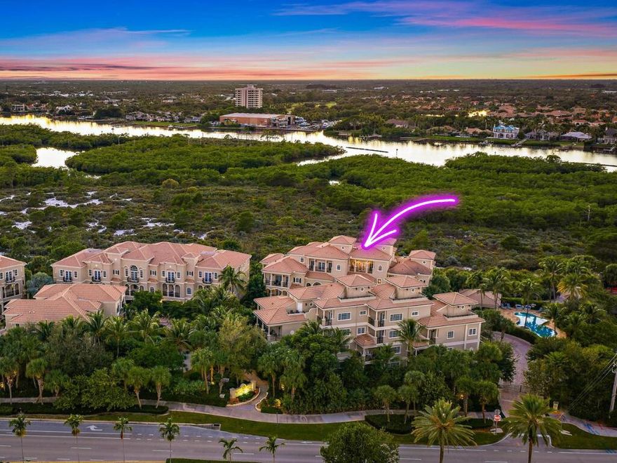 Experience luxury coastal living in this extraordinary four-story residence, including a stunning additional top-level open-air balcony, located in the exclusive, gated boutique community of Tierra Del Sol. Be sure to check out the video link next to the photo tab for a full walkthrough. Offering just over 3,900 sq ft of living space, this one-of-a-kind Jupiter home features 4 bedrooms, 3.5 bathrooms, a private elevator, a 2-car garage, and six expansive balconies showcasing spectacular western sunset views with glimpses of the Intracoastal and ocean. Elegance, privacy, and elevated living define this exceptional property. Through stately double mahogany doors, you're welcomed into a refined foyer with engineered wood flooring and abundant natural light.