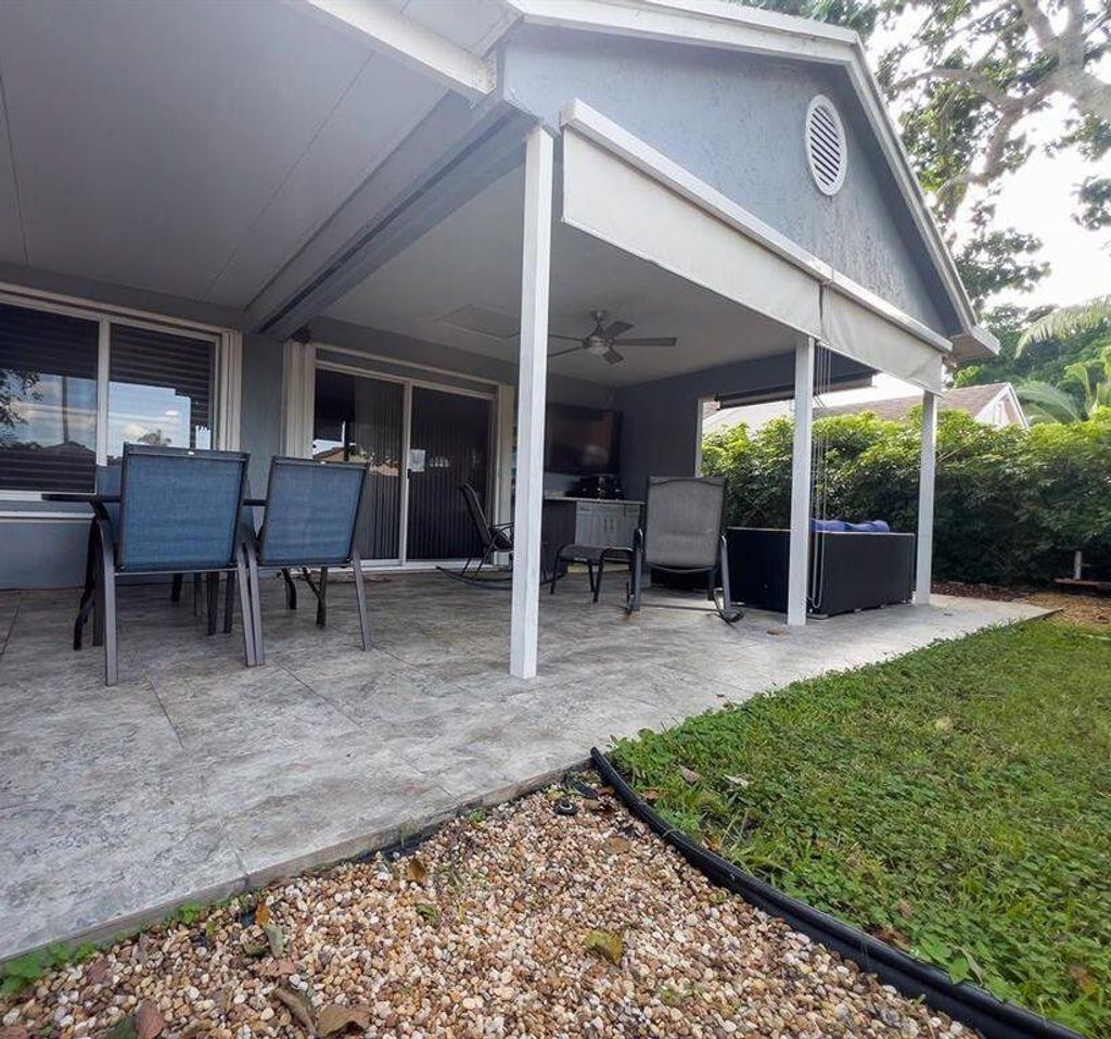 Photo of 2051 NW 35th Terrace, Coconut Creek, FL 33066 (MLS # B26004712)