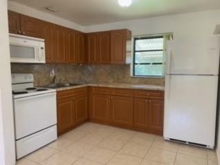 CLEAN, BRIGHT, OPEN, AND AIRY 2BED/1BATH SINGLE FAMILY HOME WITH PRIME LOCATION IN THE HEART OF HOLLYWOOD ACROSS FROM SHERIDAN PLAZA. Home features 2 spacious Bedrooms, 1 Full Bathroom, a Family Room/Dining Room, and a large Eat-In Kitchen. Tile floors throughout, brand new stove/oven combo, microwave, refrigerator, and washer/dryer. Freshly painted, four parking spaces. Amazing lush green back yard perfect for pets to run around. FAST APPROVAL. AVAILABLE FOR IMMEDIATE MOVE IN.