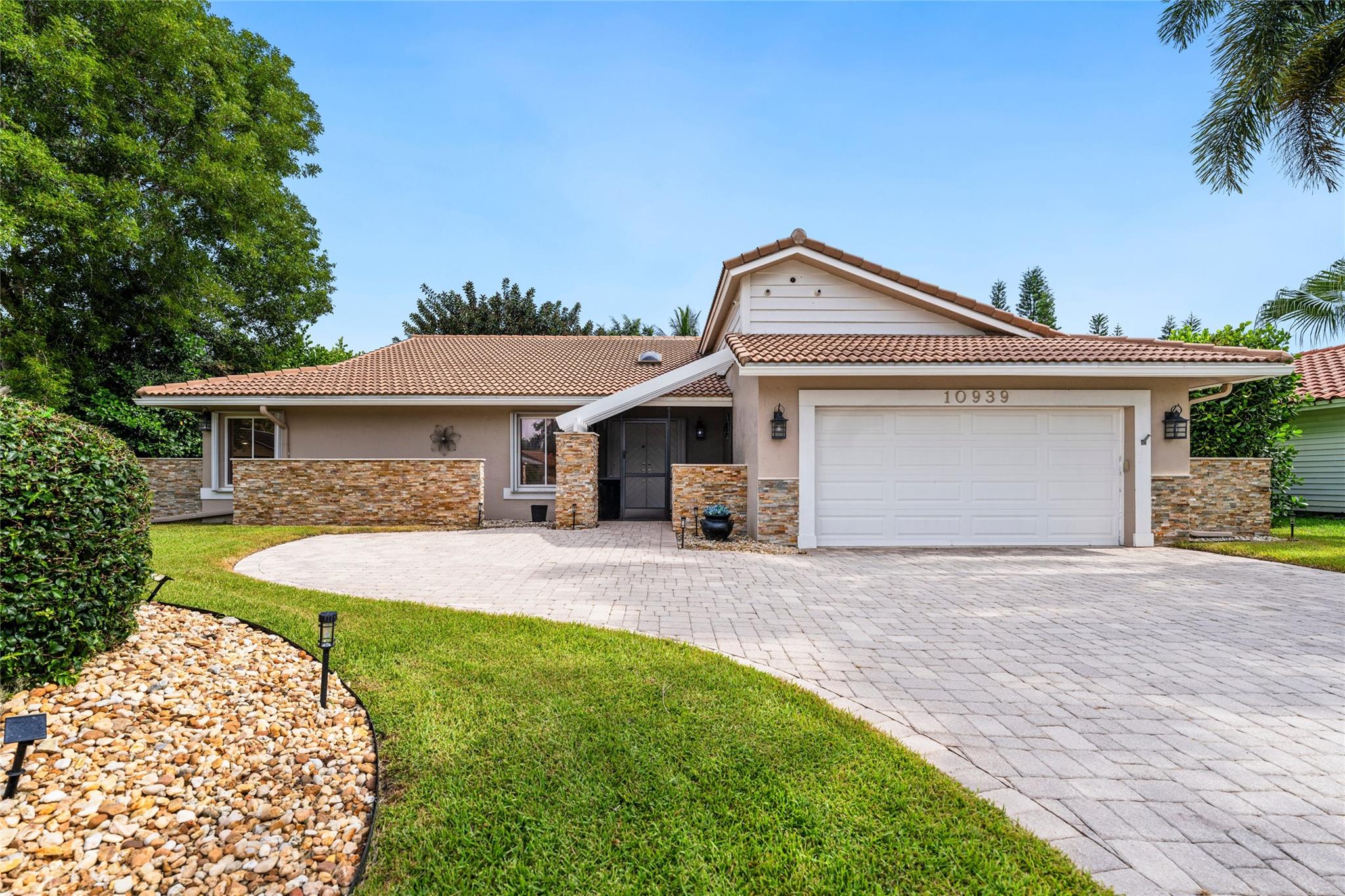 This is the home you've been waiting for...and it was worth the wait! Stunning from the inside out and completely remodeled, this 5BR, 2.5BA "smart" home offers: an open & airy floorplan w/dramatic vaulted ceilings; wood-burning fireplace; porcelain plank tile; stunning new kitchen w/white cabinets, quartz countertops and newer stainless steel appliances; crown molding; plantation shutters; fully renovated bathrooms; custom closets; new interior doors; newer a/c; new a/c ducts, antimicrobial coating & UV antibacterial light; new solar hot water heater; free-form, solar heated pool w/2 waterfalls, tanning ledges & dark blue Pebble Tec pool finish (salt system); wrap-around flagstone patio deck; accordion hurricane shutters (one impact window); an oversized and private backyard...and more!