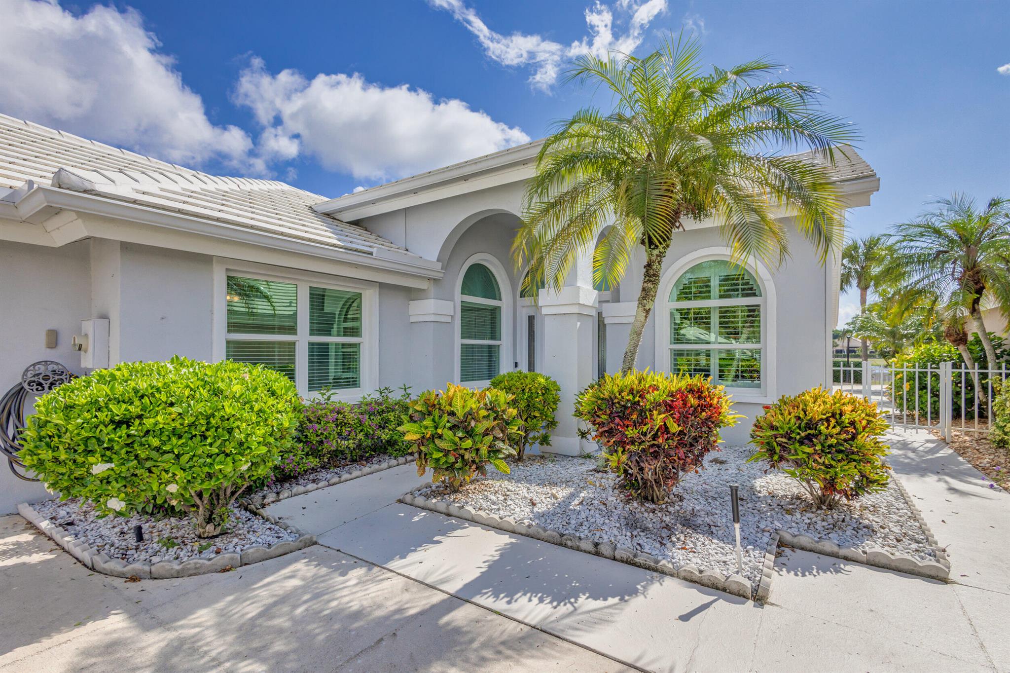 ***UNFURNISHED ****Absolutely move-in ready home! Just move in and enjoy the extensive improvements these homeowners have made. New roof 2014, impact windows and doors, Plantation shutters throughout, wood and tile floors, renovated top to bottom. Open floor plan with 2271 square feet of living space under air. Saratoga Bay is a highly sought-after community in the Bear Lakes/Villages area. The home is a 3/2 with split floor plan. The main living area has vaulted ceilings, wood floors, recessed lighting and has long views of the golf course and lake. The kitchen wall has been removed to open the flow from the living room to the kitchen. The kitchen has solid wood 42'' cabinets, a complete GE Monogram package of appliances, granite counters, undercounter lighting, wall oven, and smooth