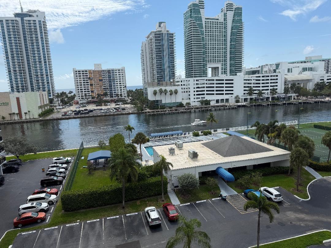 AMAZING DIRECT INTRACOASTAL VIEWS FROM THIS EXCLUSIVE RESIDENCE. This updated condo features Granite counters & stainless steel appliances. Brand new floor to ceiling impact windows & slider to balcony. Newer central AC, water heater and electric service (permits & code), w/ transferable service contract. The large bedroom offers a spacious walk-in closet & guest half bath off the foyer provides extra convenience. Located in the coveted Three Islands area. Additional features: private balcony, 24-hour concierge & security, two lighted tennis courts, a BBQ and picnic area, a waterfront clubhouse with a pool, billiards, gym, card room, & library. Just minutes from beaches, shopping, and Gulfstream . Association fees includes reserves, cable tv & internet, all prior assessments are paid off