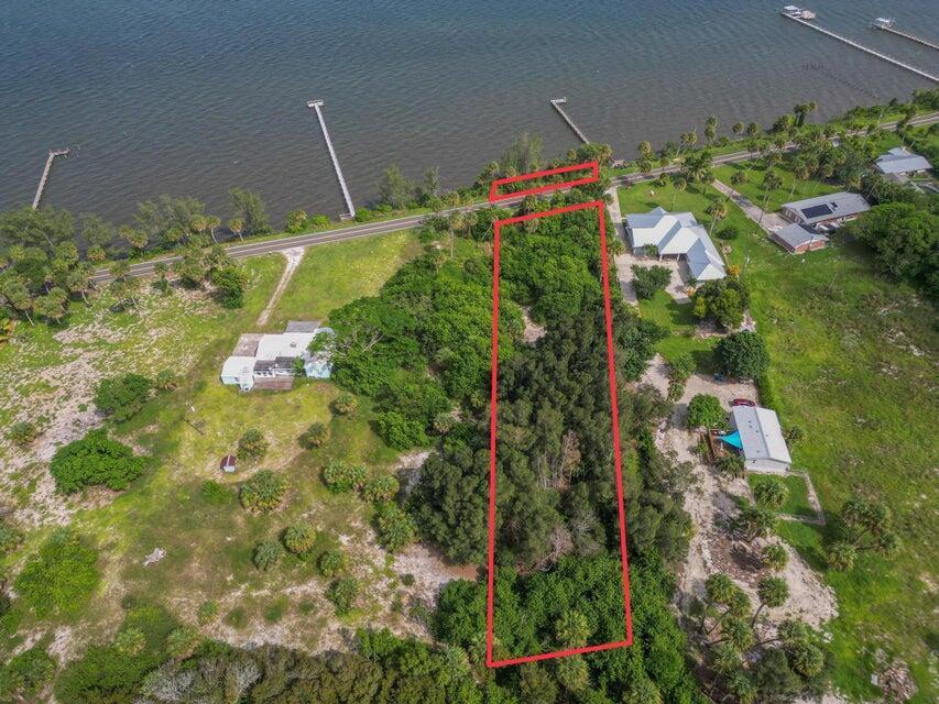 Exceptional investment opportunity for builders and investors! Seize the chance to acquire a prime 1.46-acre parcel on scenic Indian River Drive, complete with a site survey and over 100 feet of direct Intracoastal access. This elevated property features breathtaking water views, making it the perfect site for luxury waterfront development. Enjoy quick access to Jensen Beach, Hutchinson Island, and the Fort Pierce Inlet, just 2 miles away, catering to boating enthusiasts and nature lovers alike.