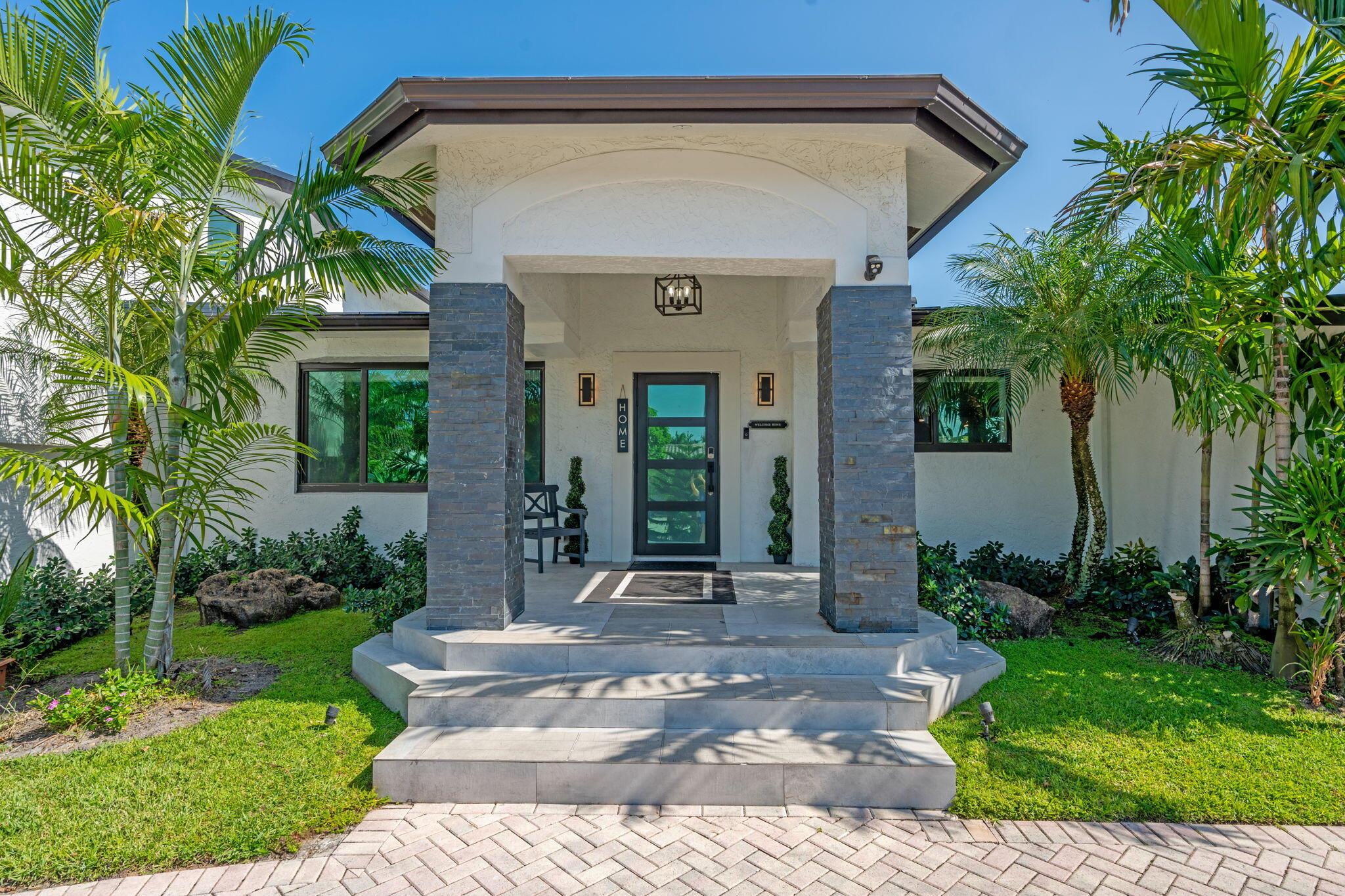 Discover luxury living in Fort Lauderdale's prestigious Coral Ridge. This fully renovated 5-bedroom, 4-bath home sits on 100 feet of wide canal waterfront with NO FIXED bridges and direct ocean access, perfect for your yacht. Step inside to a bright, open floor plan that seamlessly blends indoor and outdoor living, leading you to a spacious terrace overlooking a resort-style pool deck. This home is ready for you to move right in, featuring $150,000 in recent upgrades. Enjoy your own private spa room featuring a red light therapy sauna, traditional sauna, tanning bed, and massage bed. Whether as your personal retreat or an incredible vacation rental investment, this property embodies the best of South Florida waterfront living.