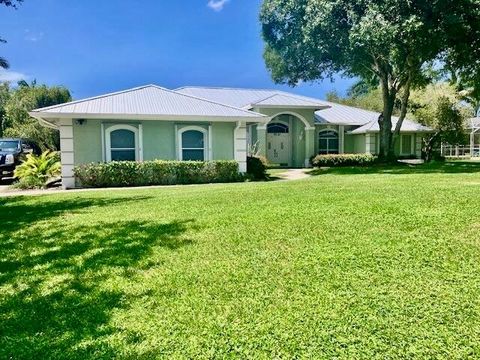 Photo of 5530 SW Orchid Bay Drive, Palm City, FL 34990 (MLS # R11113837)