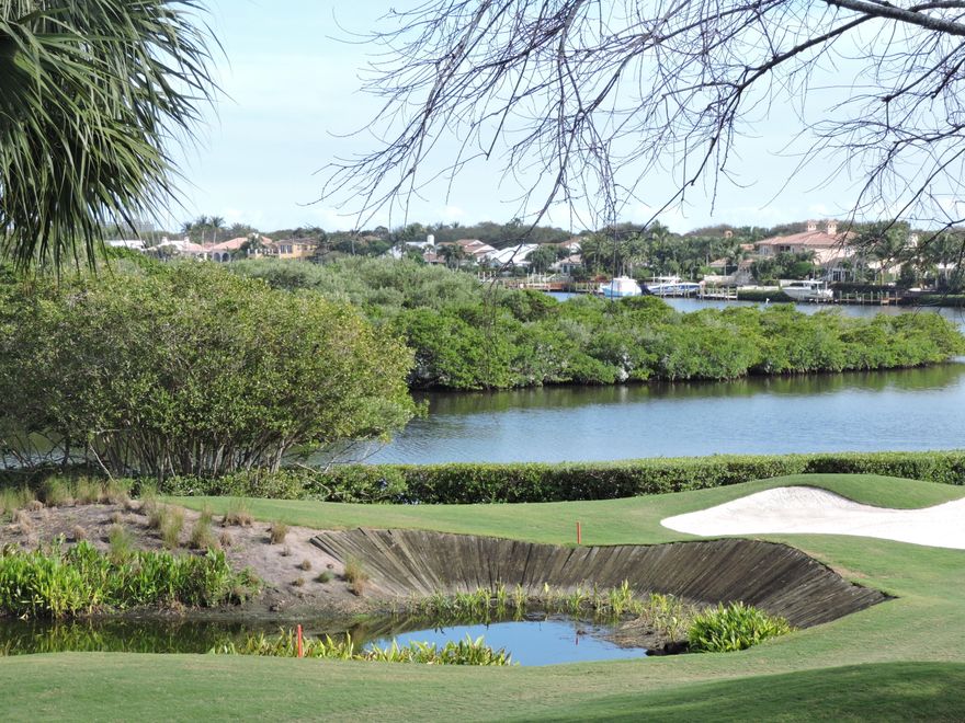 RARE TENNIS MEMBERSHIP AVAILABLE or upgrade.Expanded FULL 3 bedroom plus den, 2 1/2 baths second floor harbor home with private elevator. Brand new floor to ceiling impact sliders and windows bring the outside in. Incredible wide open water views of the lagoon, nature sanctuary and 16th fairway. Volume ceilings. Marble Floors.  Split floorplan. New chefs kitchen with top of the line stainless steel appliances, custom wood cabinetry and granite countertops/backsplash. Custom closets. Private New dock behind home. No fixed bridge.  Admirals Cove has first class amenities including 45 holes of golf, 4 restaurants, full service 63 slip marina, yacht club, full time dock master and marine store, 13 har tru tennis center, state of the art fitness center, spa and childrens programs.