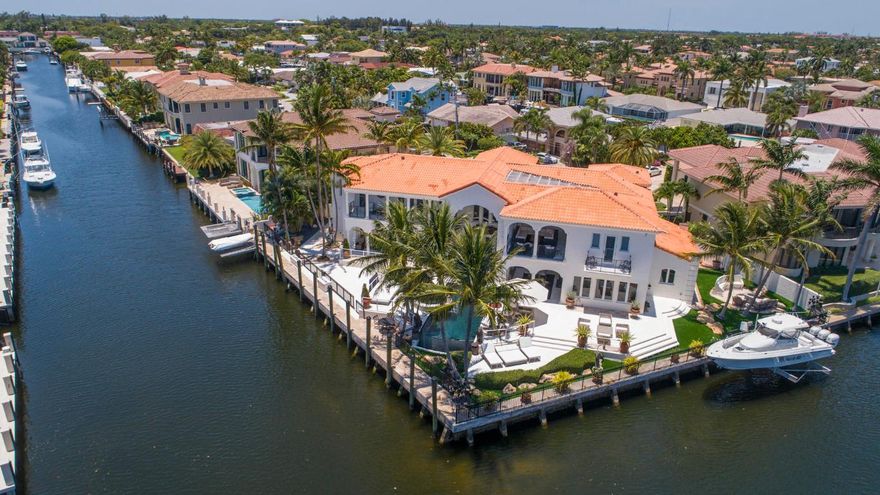 This impressive home is sited on a Prime Intracoastal Point Lot with 227' of wraparound waterfrontage with unobstructed views!  Comprised of over 9,000+/- sq. ft. (6,600+/- under air), the bright interior features a gourmet waterfront kitchen open to the family room, a two story living room, grand dining room and a rich wood-paneled library/den all with stunning views. Upstairs, 3 large family en-suite bedrooms share a beautiful waterfront den and loggia. The private spacious master wing has its own private terrace and amazing water views. An infinity edge pool and spa, two covered loggias and multiple outdoor terraces provide resort-like entertaining space, all overlooking the 122 +/- ft.  of protected dockage for a large Yacht! DISCLAIMER: Information published or otherwise provided by the listing company and its representatives including but not limited to prices, measurements, square footages, lot sizes, calculations and statistics are deemed reliable but are not guaranteed and are subject to errors, omissions or changes without notice. All such information should be independently verified by any prospective purchaser or seller. Parties should perform their own due diligence to verify such information prior to a sale or listing. Listing company expressly disclaims any warranty or representation regarding such information. Prices published are either list price, sold price, and/or last asking price. The listing company participates in the Multiple Listing Service and IDX. The properties published as listed and sold are not necessarily exclusive to listing company and may be listed or have sold with other members of the Multiple Listing Service. Transactions where listing company represented both buyers and sellers are calculated as two sales. The listing company's marketplace is all of the following: Vero Beach, Town of Orchid, Indian River Shores, Town of Palm Beach, West Palm Beach, Manalapan Beach, Point Manalapan, Hypoluxo Island, Ocean Ridge, Gulf Stream, Delray Beach, Highland Beach, Boca Raton, East Deerfield Beach, Hillsboro Beach, Hillsboro Shores, East Pompano Beach, Lighthouse Point, Sea Ranch Lakes and Fort Lauderdale. Cooperating brokers are advised that in the event of a Buyer default, no commission will be paid to a cooperating Broker on the Deposits retained by the Seller. No commissions are paid to any cooperating broker until title passes or upon actual commencement of a lease. Some affiliations may not be applicable to certain geographic areas. If your property is currently listed with another broker, please disregard any solicitation for services. Copyright 2020 listing company All Rights Reserved.