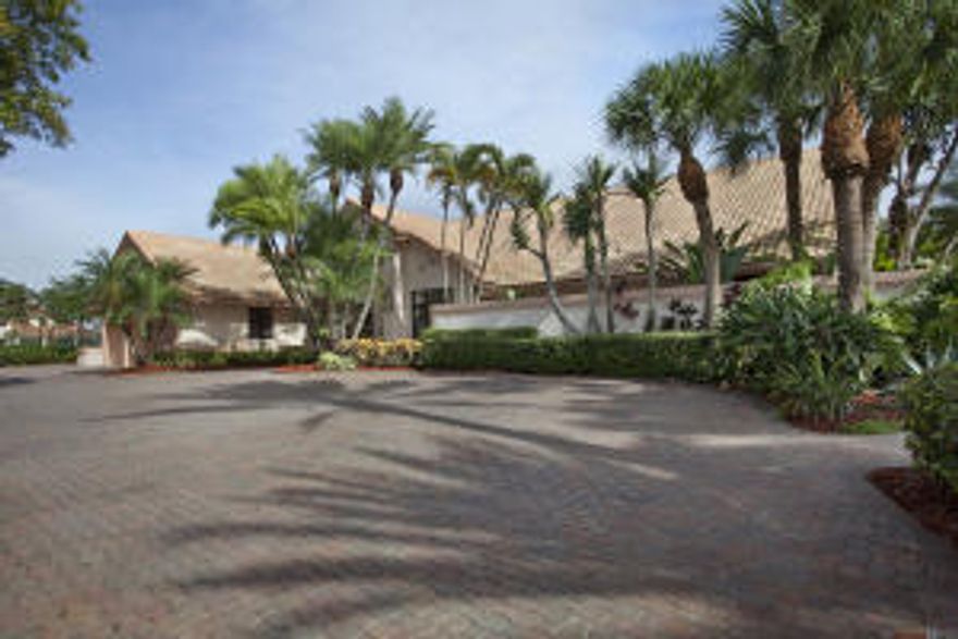 Spectacular DOUBLE RUNWAY LOT estate in Wellington Aero Club features a 2640 sf hangar directly on the runway, with a 57 ft wide opening, a lighted helipad on the second runway lot, full lighted tennis court and lap pool.  The location of this property is situated perfectly now that WAC allows Light Jets (under 12500 lb, passing the Stage 3 requirements)to fly in.  With its private electric security gate as you enter the property, this 5,399 sf 5 bed, 6 1/2 bath estate is the best property in the whole community.  The home was tastefully remodeled in 2008 with marble flooring throughout, gourmet kitchen, oak ceilings in family and lookout room.  This is a one of a kind property that must be seen by the aviation enthusiast.