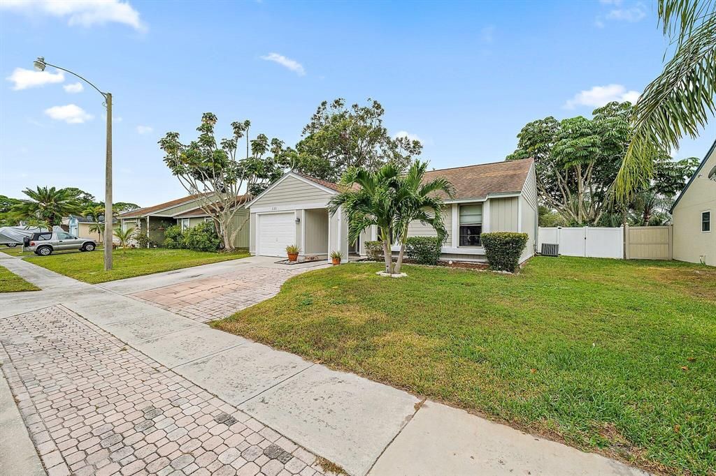 Photo of 111 Rosewood Circle, Jupiter, FL 33458 (MLS # R10862413)