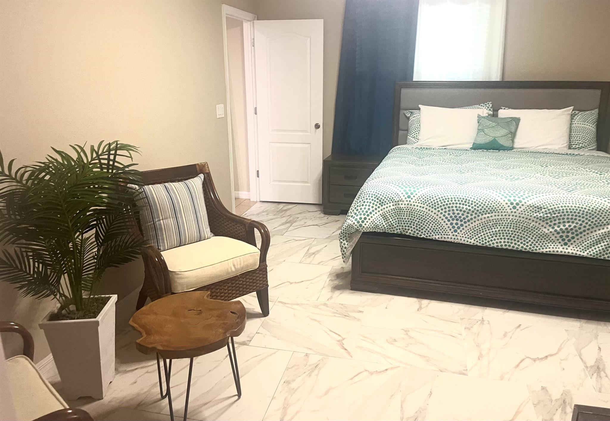 This cozy and fully furnished efficiency unit feels just like a hotel! It has a spacious 1 bedroom and 1 bathroom, plus a separate shower, a double sink vanity, and kichenette. You'll love having your own private entrance, a parking spot, and laundry and utilities (electricity, water, cable, Internet) included. There's even a water softener system. The location is perfect - close to Port Saint Lucie Blvd, I-95, and the Turnpike, so you can easily get to restaurants, shops, and more. You must see it..!