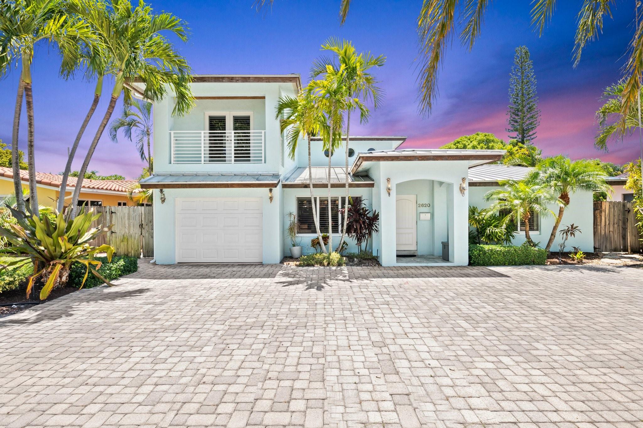 Nestled in the heart of Lighthouse Point, this residence blends modern elegance with tropical coastal living. Inside, you'll find a welcoming ambiance with a thoughtfully designed kitchen and living area, high ceilings, and hurricane impact windows and doors throughout. The first floor includes the primary suite and a guest bedroom, while upstairs offers a cozy den and an additional guest room & full bath. Fully renovated in 2008, this home features an aluminum metal roof and updated PVC plumbing. The backyard is an entertainer’s dream, complete with a pool, a generously sized covered patio with a bar, and a Tiki Hut—this is the perfect setting for entertaining guests or relaxing by the pool. Walk to Publix, Whole Foods & restaurants. The beach is just a short golf cart or bike ride away!