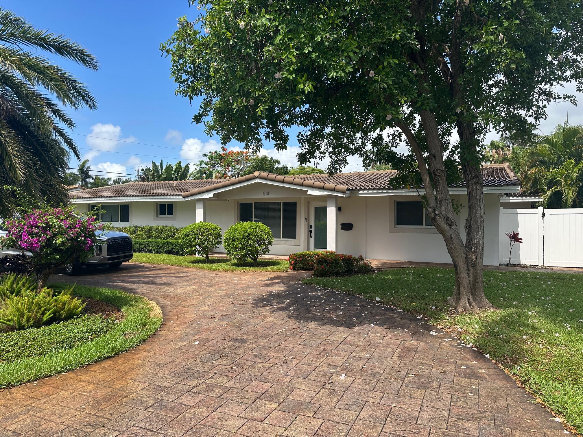 Successful AirBNB FOR INVESTORS! Fully Remodeled Home in Lighthouse Point!! Open floor plan with split bedrooms, a large covered screened patio overlooking the heated salt water pool, deck and fenced yard. Great for entertaining! Upgrades include: 2015 roof, impact windows and doors throughout, tile flooring throughout, completed new bathrooms, beautiful fixtures, new doors and moldings, and new kitchen with quartz countertops, cabinets and ss appliances. 2017 includes a new circular paver driveway, washer and dryer, tankless water heater, new landscaping and sprinklers , and has security cameras. 2021 includes pool pump, salt water system and pool heater. Furniture included and ready to move in to the most desirable Lighthousepoint area!