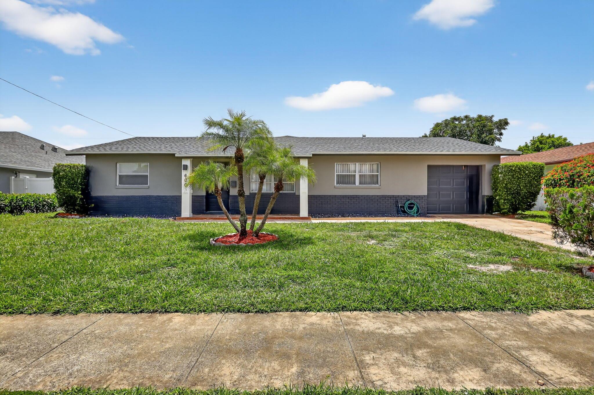 Welcome to this beautifully renovated single-family home in the heart of West Palm Beach, located in the desirable Roosevelt Estates neighborhood. No HOA and no restrictions -- enjoy the freedom to live as you choose! This move-in-ready home features a brand-new roof, new stainless steel appliances, washer and dryer, updated electrical panel, and a brand-new sprinkler system. With modern finishes throughout and thoughtful upgrades, this property offers both comfort and peace of mind. Conveniently located near shopping, dining, major highways, and just minutes from downtown and the beach. Don't miss this opportunity!