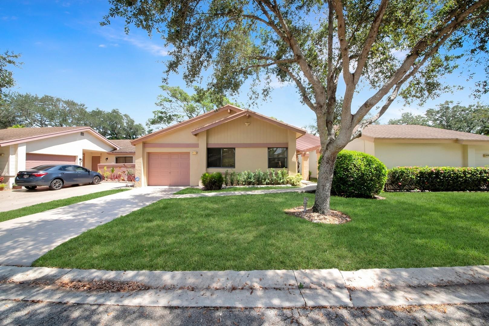 This stunning move in ready home has everything you have been searching for. It is located in the highly desirable community of Sawgrass Village 1 in Coconut Creek. This community is a 55+ community, very well maintained, and has access to all of the great Township amenities. This beautifully remolded one-story home is designed for comfortable and effortless living. No details have been over looked in this move-in ready residence. This home has been completely remodeled. Enjoy an updated kitchen with modern finishes, stylishly updated bathrooms, and new flooring throughout. This home is also extremely energy efficient. Benefit from a newer installed roof, impact windows and doors, and a state-of-the-art solar panel system resulting in super low year round power bills. Call today for a tour