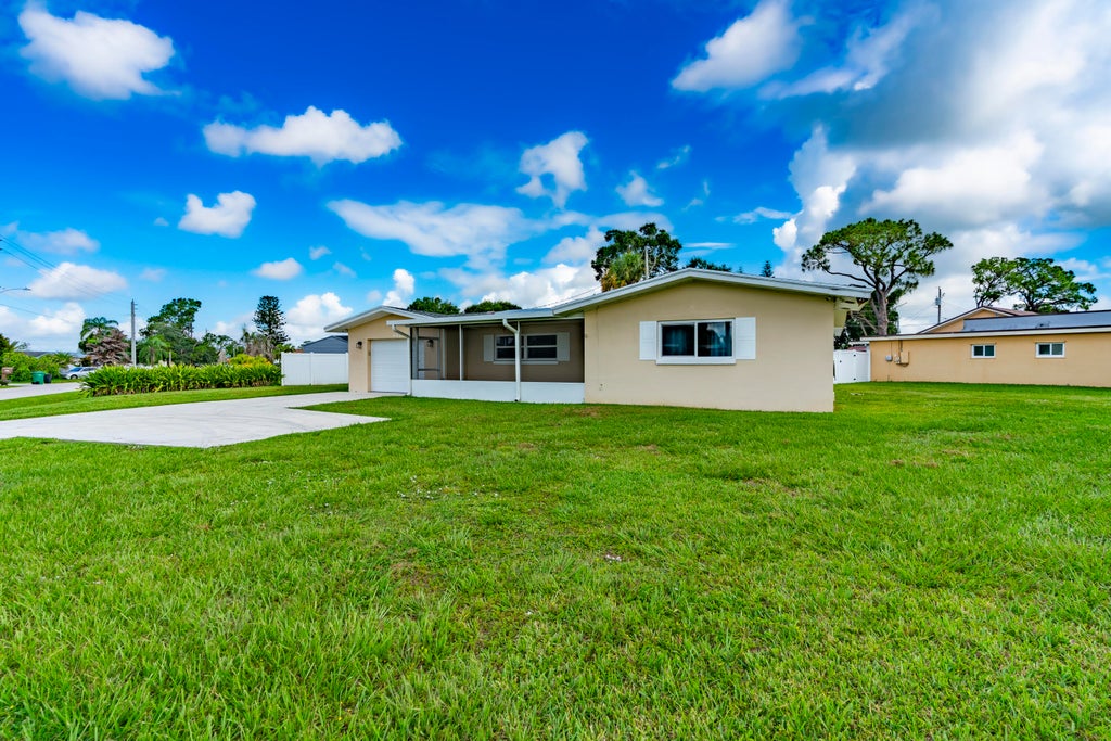 Photo of 613 Beach Avenue, Port Saint Lucie, FL 34952 (MLS # B26049265)