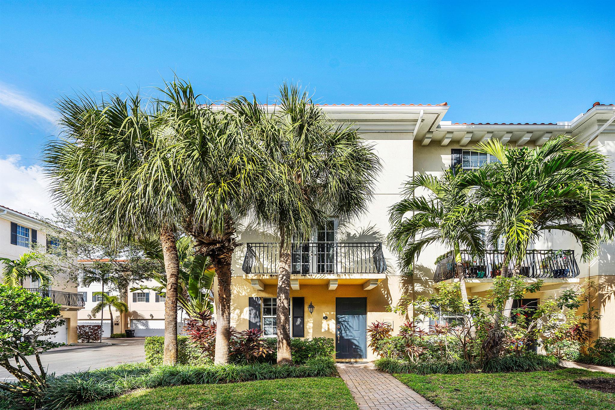 This stunning three-story corner townhouse in the Courtyards of Lake Worth offers the perfect blend of space, style, and location. Nestled next to Spillway Park and just a short distance from the beautiful Intracoastal Waterway, it's an ideal spot to enjoy everything the area has to offer.Inside, the second floor features an open and airy layout, perfect for entertaining. French doors lead to a private balcony overlooking the courtyard, where you can relax and enjoy the Florida sunshine.The third floor hosts the master suite and a second bedroom, each with its own en-suite bath for maximum comfort. On the first floor, a private bedroom with a full bath is perfect for guests or a home office. A convenient half bath on the second floor adds to the home's functionality.Take