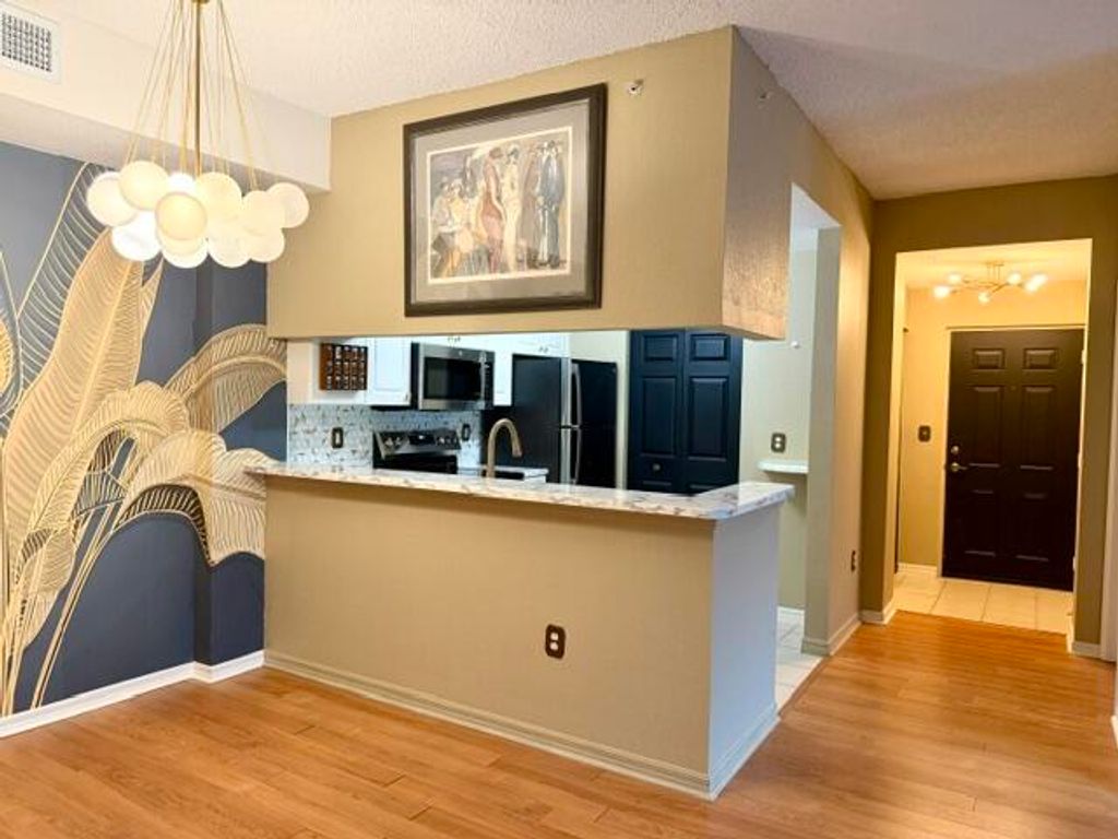 Photo of 2915 Tuscany Court #201, Palm Beach Gardens, FL 33410 (MLS # B26032112)