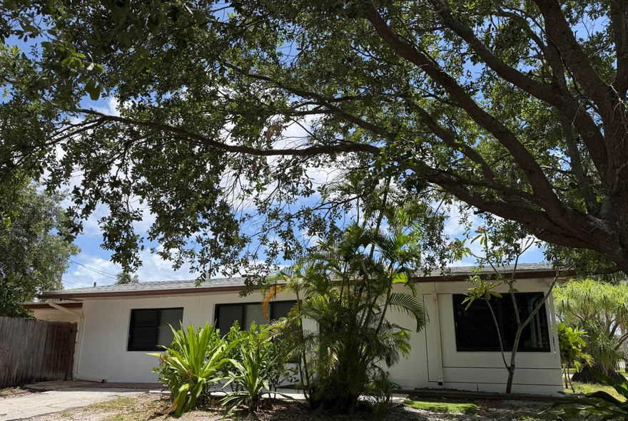 Spacious 3/2 on a corner lot with huge pavered yard.   Fabulous for cookouts or any activity plus a  Double gate gives access to park  aTrailor, boat, or cars etc in.  This home has almost all impact windows.   Nice white kitchen!  Formal dining room, and good size living room .   Full size washer /Dryer.  Fabulous location, close to parks, major highways, shopping, worship, etc... AC motor replaced in 2024.  Roof about 6 yrs old.     No HOA , easy to show!