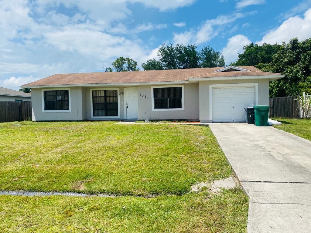 Photo of 1361 SW Bellevue Avenue, Port St Lucie, FL 34953 (MLS # R10877549)