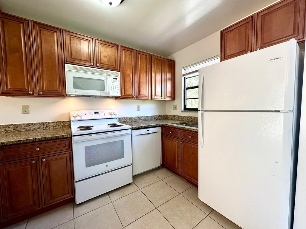 Photo of 1232 N Haverhill Road N #3, Haverhill, FL 33417 (MLS # R11035260)