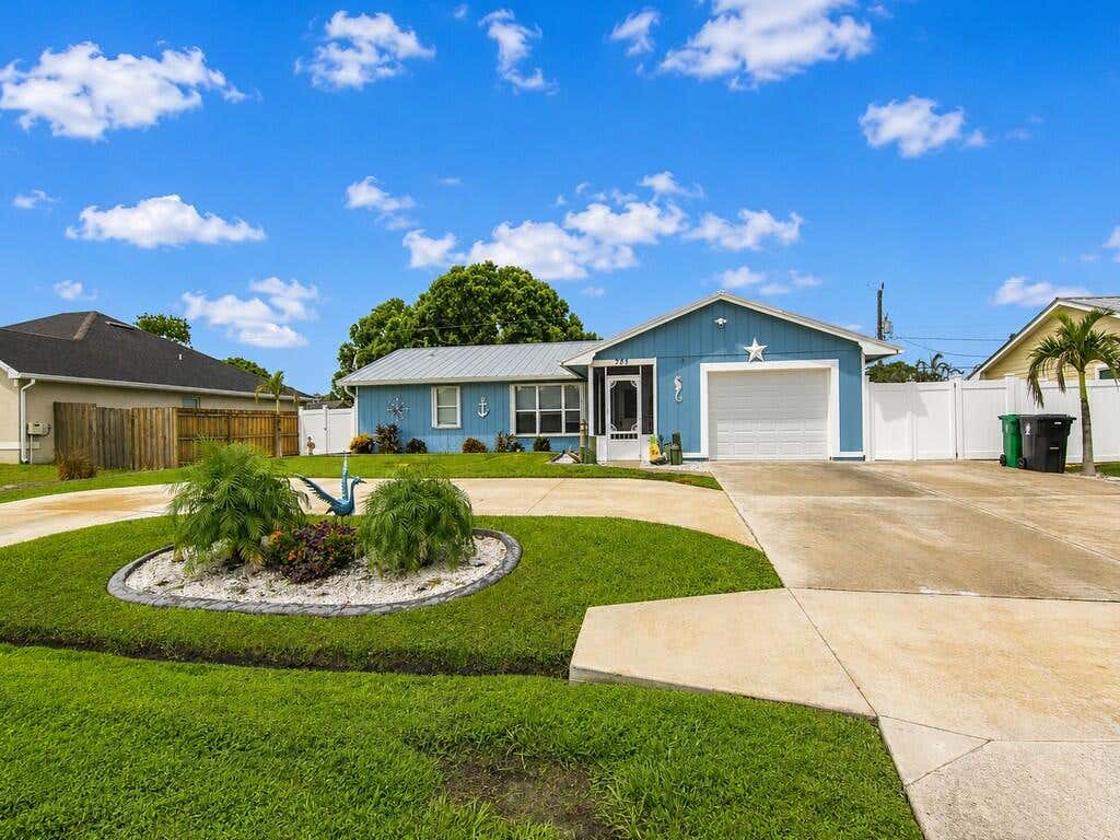 Photo of 261 SE Wallace Terrace, Port Saint Lucie, FL 34983 (MLS # B26057667)