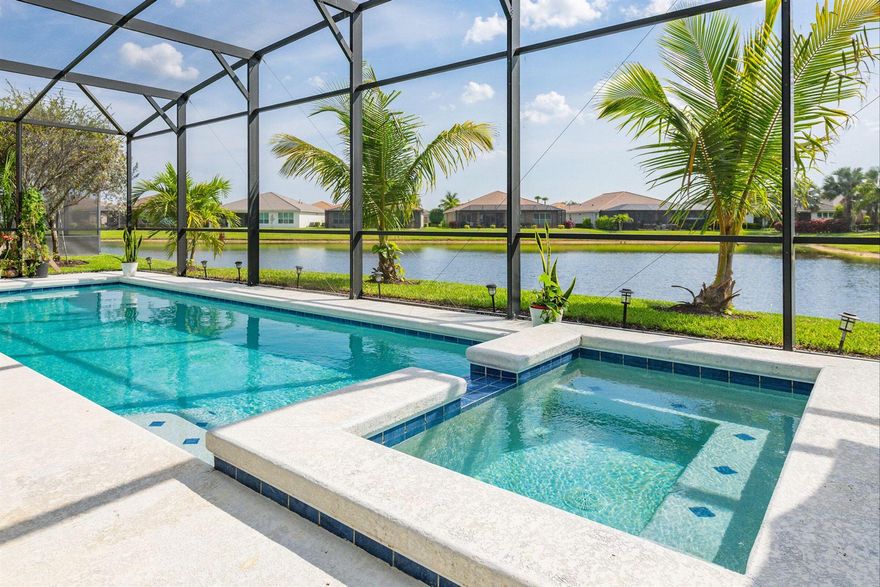 This LAKEFRONT POOL HOME sits on one of the BEST LOTS in Tradition offering real no filter SUNSET VIEWS, HEATED POOL & SPA, and a PRIVATE CUL-DE-SAC location on sought-after Vitalia Court, originally planned as MODEL ROW. Built in 2016, 3 BEDROOMS, PLUS a DEN, and 3 FULL BATHS and enjoy TWO PRIMARY SUITES on each wing of this home, CBS secured with IMPACT GLASS windows, and UPGRADED FLOORING throughout. The open layout highlights long lake views and effortless indoor-outdoor living. Enjoy a PRIVATE BRIDGE TO THE CLUBHOUSE and access to resort-style amenities. LOW INSURANCE & the HOA includes CABLE, INTERNET, ALARM, LAWN CARE, GYM, TENNIS, PICKLEBALL, POOL & MORE. Close to CLEVELAND CLINIC, TRADITION SQUARE, shopping, and 35 MINUTES TO THE BEACH. Located in a premier 55+ gated community