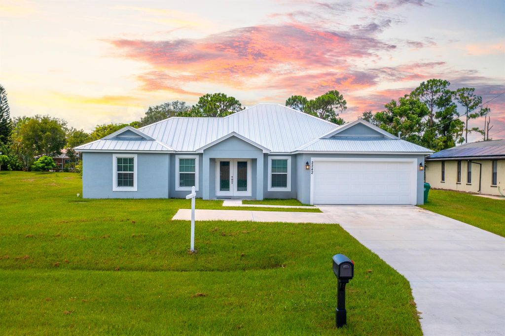 Photo of 2242 SE Grand Drive, Port St Lucie, FL 34952 (MLS # R10903402)