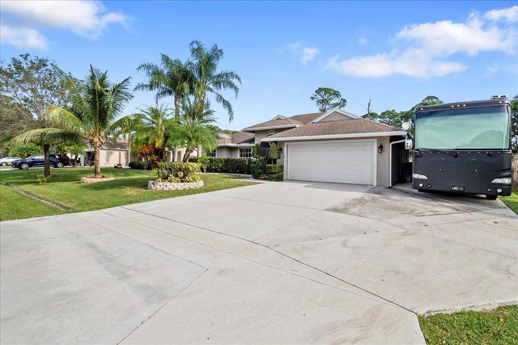Photo of 3851 SW Ramspeck Street, Port Saint Lucie, FL 34953 (MLS # R10940666)