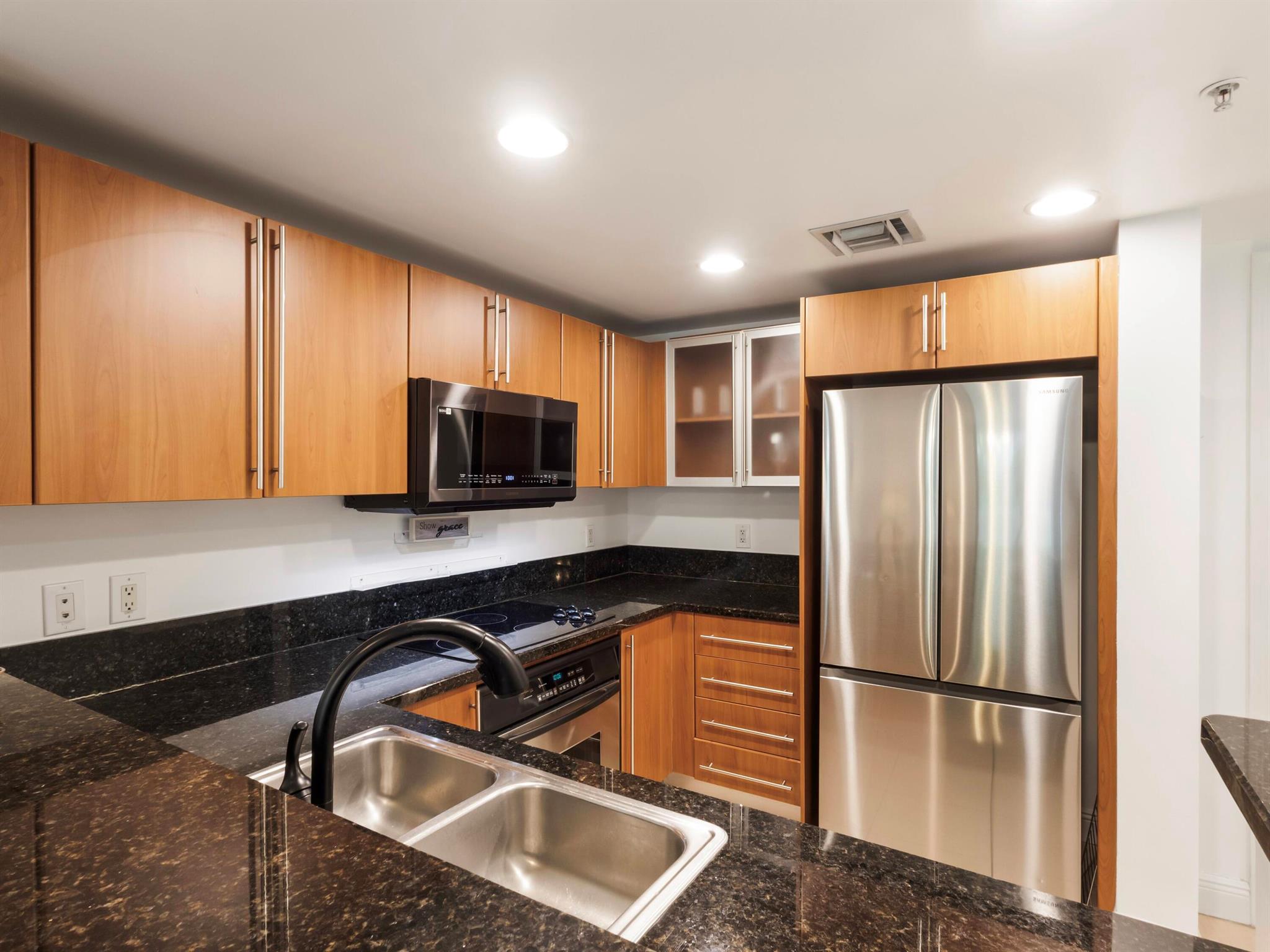 ''Welcome to 610 Clematis, a premier downtown residence offering unparalleled luxury and security. Enjoy peace of mind with 24-hour roving security, controlled access parking, personalized key card entry, and closed-circuit TV monitoring.Unwind on the stunning Sunrise Deck, featuring an infinity-edge heated lap pool and outdoor spa surrounded by lush tropical landscaping. The perfect spot for exercise or relaxation. Find your serenity in the Sunset Meditation courtyard, a beautifully landscaped 3,400-square-foot oasis with a Zen Garden, walking paths, and two BBQ areas.Stay active in the fully equipped Fitness Center. This 2/2 split floor plan condo boasts an expansive patio with breathtaking views of the courtyard and pool. Additional features include:Tile throughoutAppliances