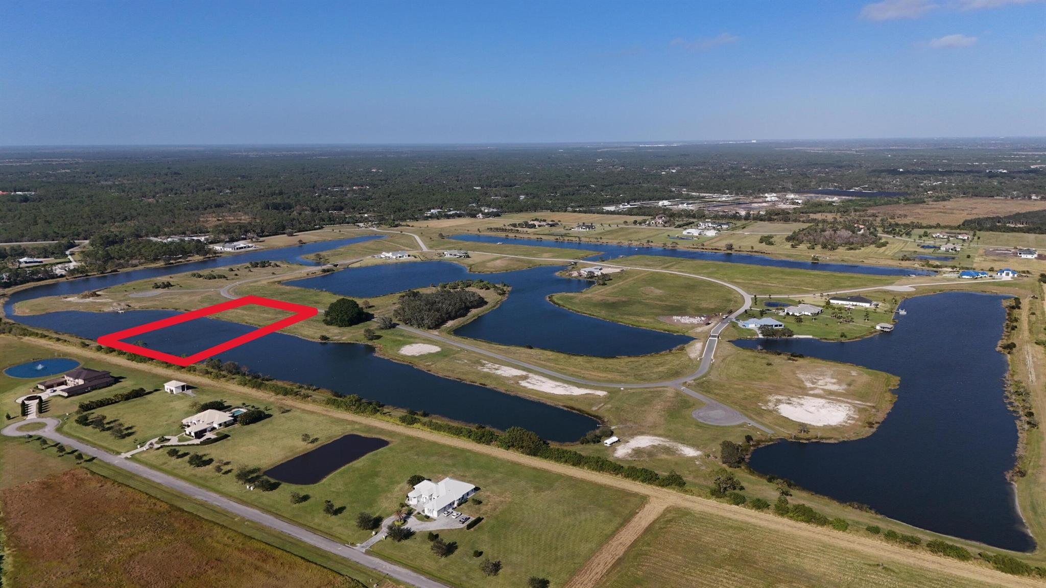 Welcome to this stunning waterfront property located at 6750 SW Pentalago Cir in Palm City, FL. This lot consists of roughly 1.9 acres upland and 3.1 acres submerged. Main portion of lot is approx. 300 feet wide by 190 feet deep. Pentalago is a gated residential lake community designed for tournament water skiing, and includes 5 interconnected lakes and 42 lakefront lots. Bring your own Custom Builder and build the home of your dreams. Upland varies by lot, average upland is 3 /-acres with 2 /- acres of water. (5 Acres total).