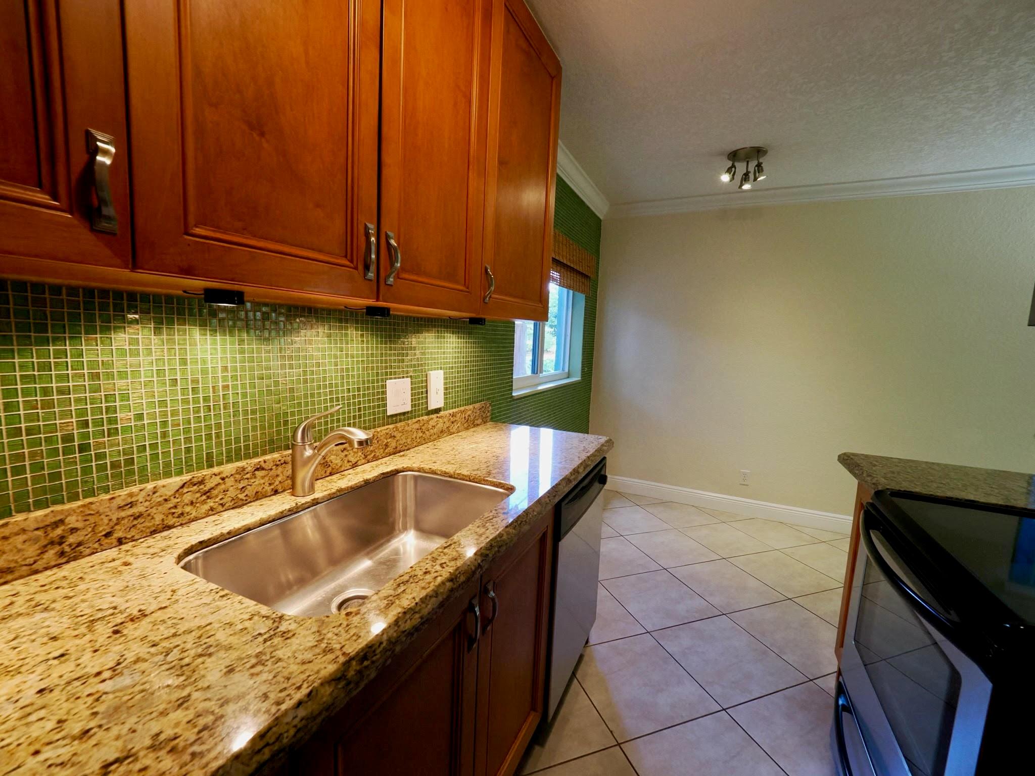 Beautifull condo in desirable Poinsettia Landings, a hidden gem. No pending assessments. 40/10-Year Building Safety Inspection Completed. Corner unit offers private large fenced-in patio w/ retractable awning. Patio opens to spacious common area. Dimmable soffit bedroom lights, glazed bathroom tub/walls. Ceramic flooring throughout, SS appliances, wood cabinetry, granite & tile in kitchen & bath. Lush landscaping, heated pool, BBQ area. On-site laundry. Pet friendly. No aggressive breeds. Foreign seller. Property rented until August 31st. Photos were taken prior to tenant's occupancy. Located near Wilton Drive, Downtown Ft. Lauderdale, shopping, nightlife, restaurants & beach. Information is deemed reliable but not guaranteed.