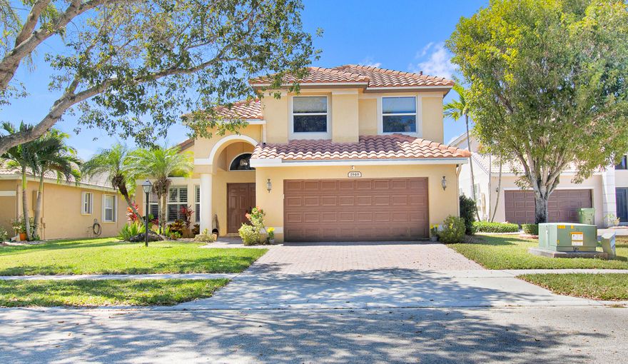 Known for its resort-style amenities, Pembroke Falls is the most desirable community in the city, and this affordable 4/3 home has every feature you desire. Begin outdoors, with its new roof, long lake views and a full-size screened pool, then step inside to a downstairs master suite. Impact windows and the garage door is impact too!  Travertine marble flooring in the common area, dark cognac bamboo in the bedrooms and stairwell. Modern baths. Everything has been replaced, as needed; the roof in 2021, the AC in 2023, the dishwasher in '25, the dryer in '24, the pool pump in '25. There's a large open patio to enjoy the sunsets; granite countertops, and a gas range for the picky cook. The home is located on one of the community's rare cul-de-sacs, cable, security and internet are included.