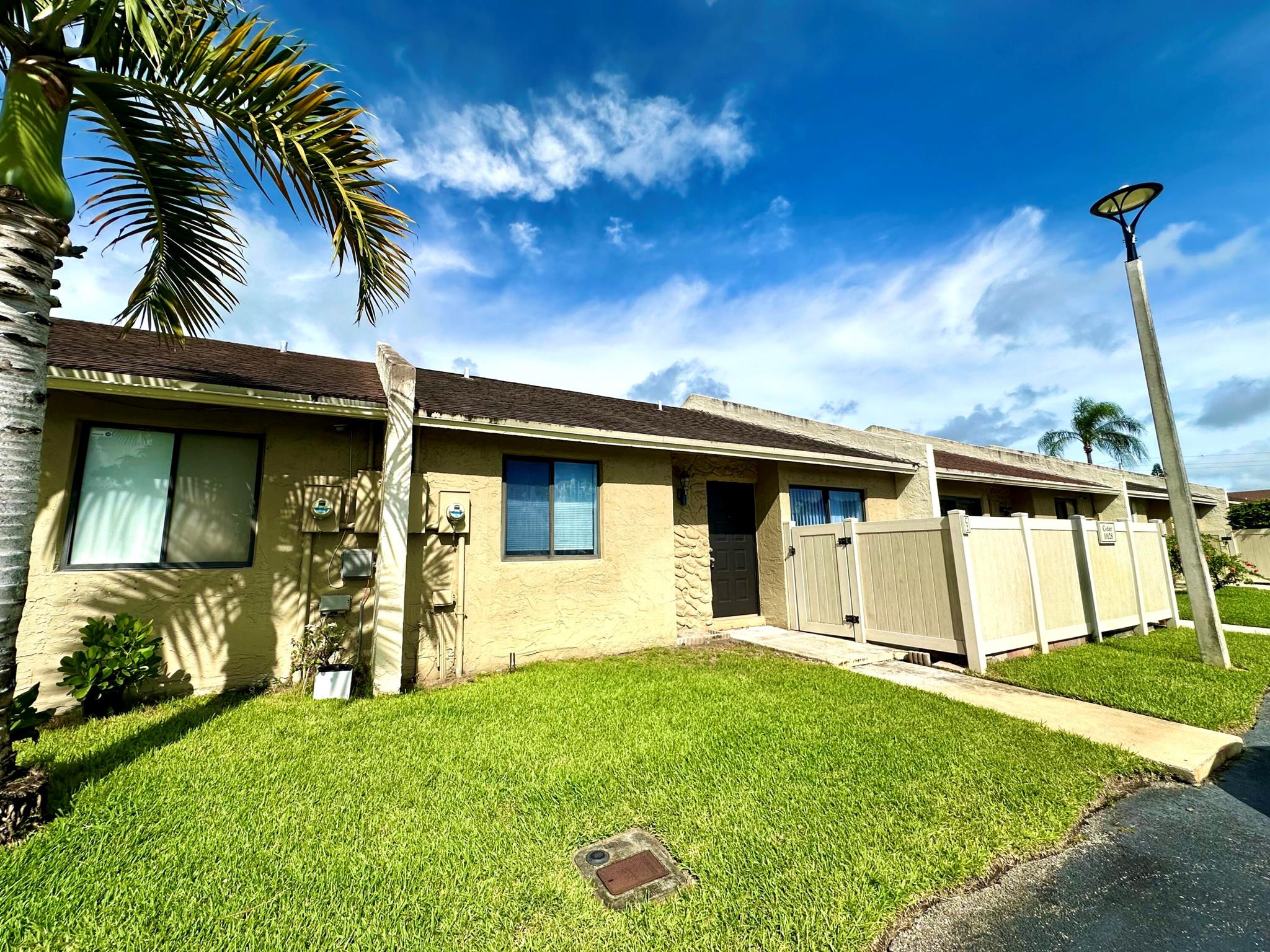 Welcome to Boca Bend HOA! This is an amazing opportunity to own a beautifully updated 2-bedroom, 2-bath villa in Boca Raton. The home features vaulted ceilings, ceramic tile flooring throughout, and a full-size side-by-side washer and dryer. The Kitchen retains its original charm while offering modern touches with granite countertops and newer appliances. Plenty of closet space & a walk-in closet in the master bedroom. Private, fenced-in front patio and open backyard, perfect for relaxation or entertaining. Located in a highly desirable school zone with top-rated Boca Raton public schools. Super-low monthly HOA dues, which cover common areas, roof maintenance & insurance, landscaping, and access to the community pool. Investor-friendly, unit can be rented immediately after closing