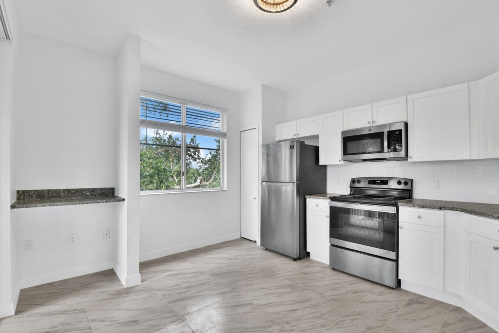 Photo of 11026 Legacy Drive #302, Palm Beach Gardens, FL 33410 (MLS # R11018578)