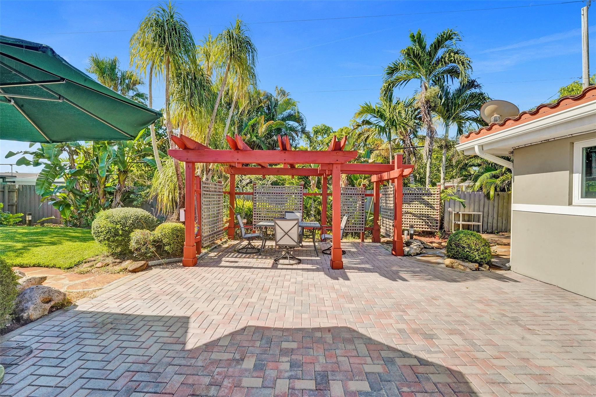 This beautifully maintained home offers peace of mind and modern comfort with a 2019-barrel tile roof, casement-style impact windows, new A/C, and updated sewer pipelines. Inside, you’ll love the granite countertops in both the kitchen and bathrooms, complemented by classic oak cabinetry and new stainless-steel appliances. The updated electrical panel ensures everything runs smoothly. The spacious Florida room is enhanced with a new mini split A/C, perfect for year-round enjoyment. The large one-car garage features epoxy flooring for durability and style, while the fenced backyard with a charming pergola offers the ideal spot for relaxing or entertaining. Conveniently located near major highways, this home blends modern upgrades with everyday functionality.