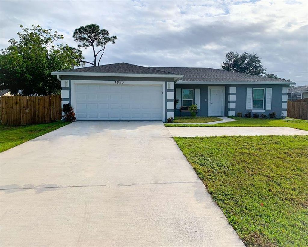 Photo of 1853 SW California Boulevard, Port Saint Lucie, FL 34953 (MLS # R10770132)