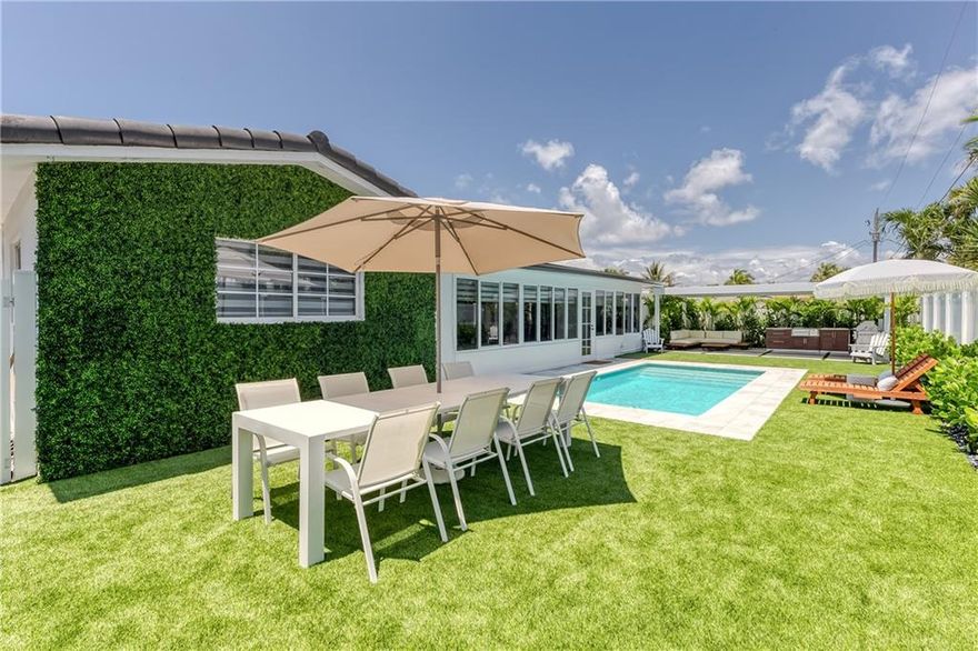 From the moment you pull in the driveway you are greeted by the clean and sophisticated look of this 3 bed, 2 bath remodeled home.  Located in the heart of Lighthouse Point's most desired neighborhood of Lake Placid this home has it all!  Enjoy entertaining in this beautifully remodeled kitchen with custom Italian Cabinetry, high end appliances & large cooking island.  The primary bedroom features awesome built in closets, a custom bathroom with free-standing spa tub, walk-in shower, custom lit mirrors & more.  The new backyard is perfect for entertaining & you will never want to leave!  It has a new pool, amazing covered patio for entertaining, built-in grill, turfed yard & more!  The home also features  impact windows & doors and a new driveway, no detail has been missed! No detail has been left unturned in this home.  The kitchen is an amazing Chef's kitchen with induction cook-top with side burner grill and custom vent hood.  The kitchen also features a large wine fridge, double column refrigerator and freezer & tons of storage.  The backyard was just remodeled and features a fully fenced yard with custom turf, large pergola and an amazingly function and high end grill and bar area.  This is the perfect place to entertain and enjoy all that living in South Florida has to offer.  At night the backyard is a tropical oasis that transports you to a high end resort with amazing garden lighting and tranquil ocean breezes.