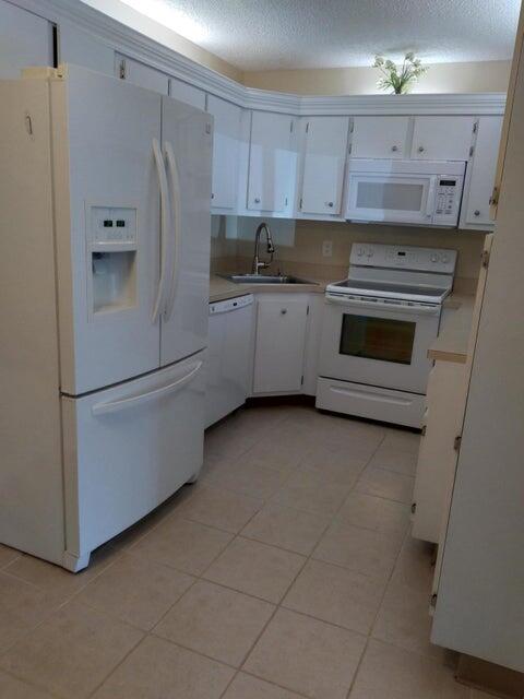 Photo of 820 Sky Pine Way #C1, Greenacres, FL 33415 (MLS # R10974247)