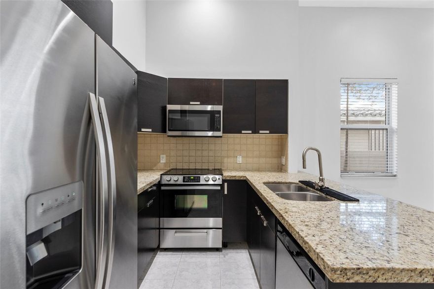 Discover modern living in this stunning Fort Lauderdale townhome, ideally situated near the vibrant downtown scene. This 3-bedroom, 2.5-bath (+den/office) property boasts sleek finishes, an open-concept layout, and abundant natural light. The spacious kitchen features high-end appliances and a breakfast bar, perfect for entertaining. Relax on your private patio or take a short stroll to nearby hotspots. Enjoy easy access to Las Olas Boulevard's trendy restaurants, boutique shops, and art galleries, or explore the scenic Riverwalk. Just minutes from Fort Lauderdale Beach and major transportation hubs, this home offers a perfect blend of convenience and urban charm. Full size washer/dryer inside the townhome. Private, fenced in spacious backyard. 1 car garage! NO HOA - MOVE IN TOMORROW!